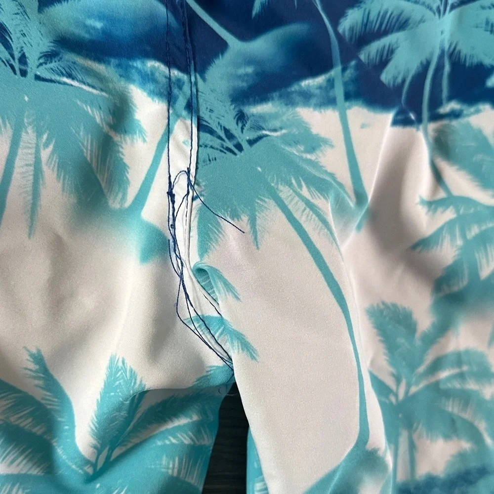 ZeroXposur Blue and White Palm Tree Swim Trunks